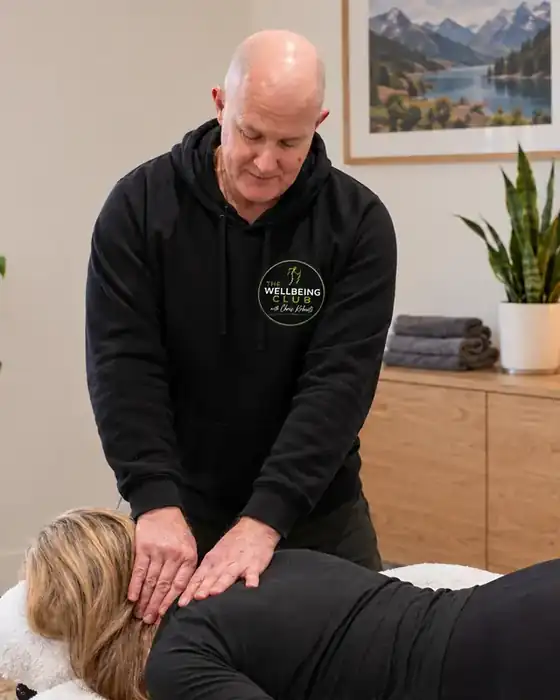 Chris Roberts giving a client a massage at home